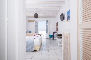 DELUXE TRIPLE ROOM: Double bed or two twins beds and a sofa bed, balconies in second floor with pool and sea view.